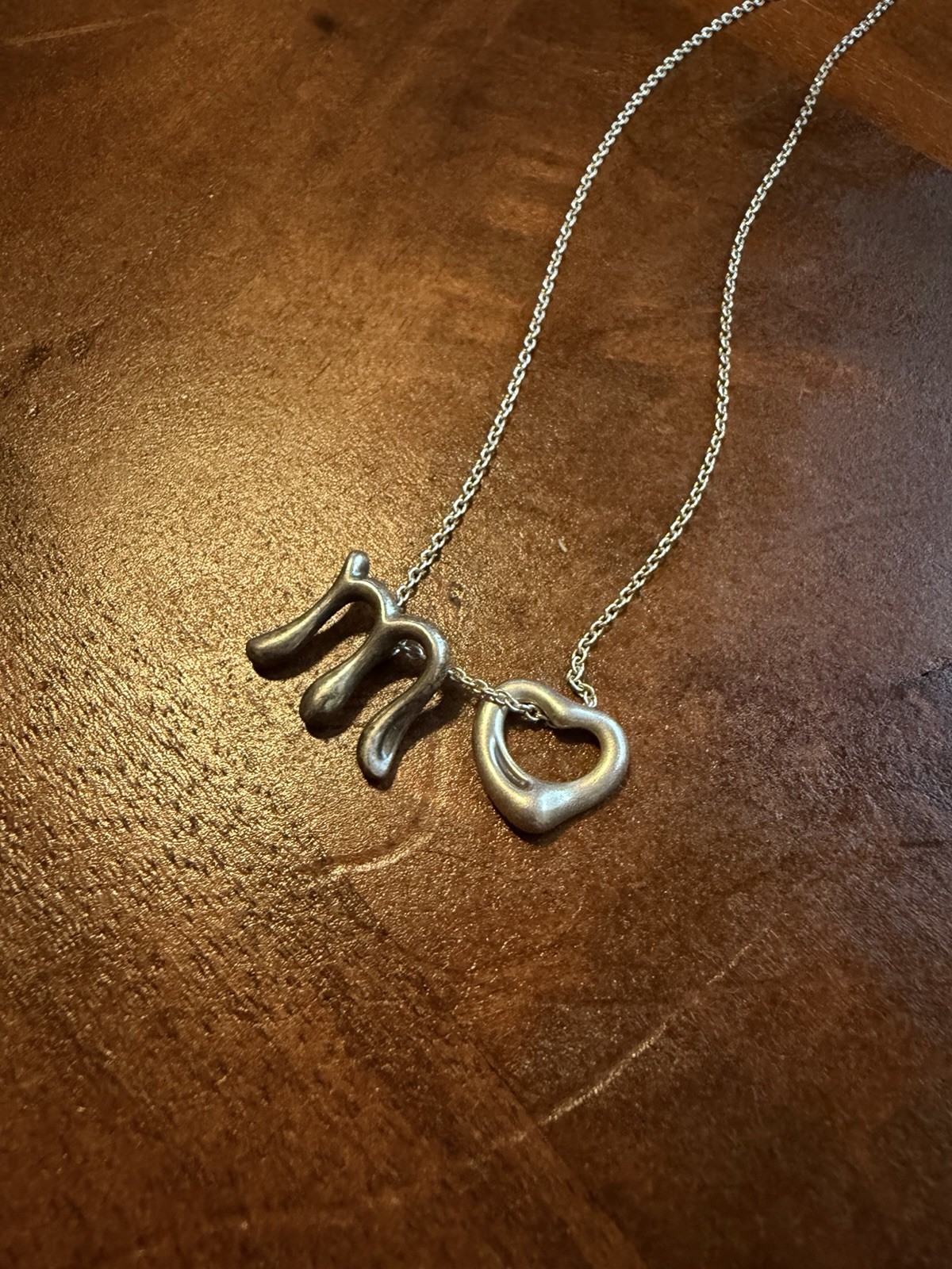 Tiffany & Co. Elsa Peretti Alphabet Initial Letter “M” And Open Heart Pendant