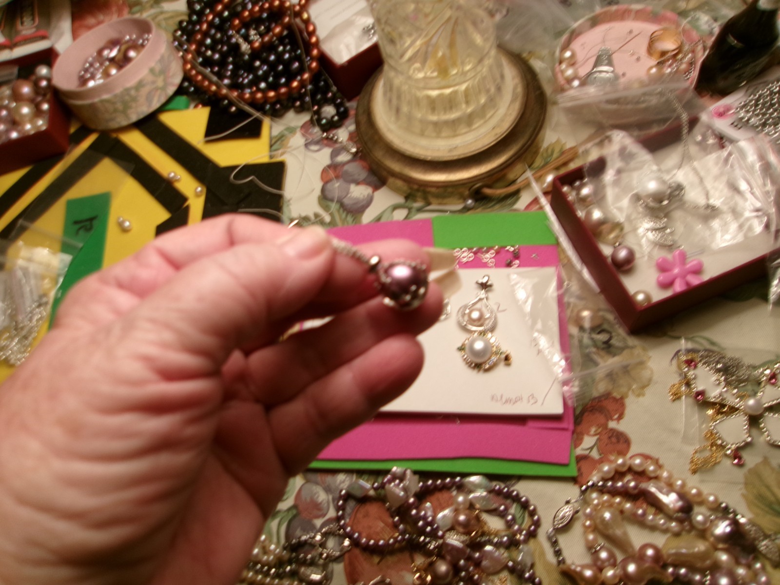 PEARL IN CAGE ABOUT 12.50 TO 13MM BETWEEN.COLOR FABULOUS I PAID 75.00 FOR THE P