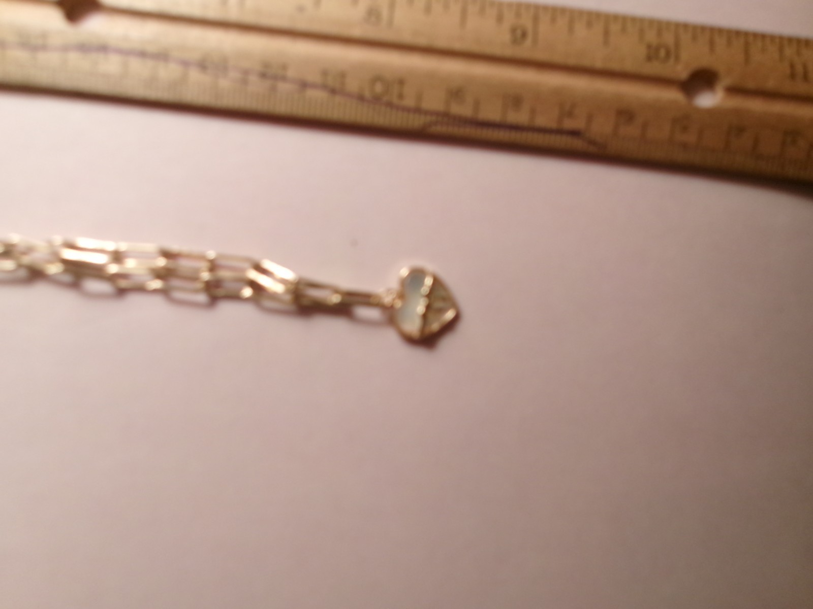 PEARL NICE SIZE REAL PEARLS…THE HEART HAS LIKE A WHITE SHELL INSIDE IT