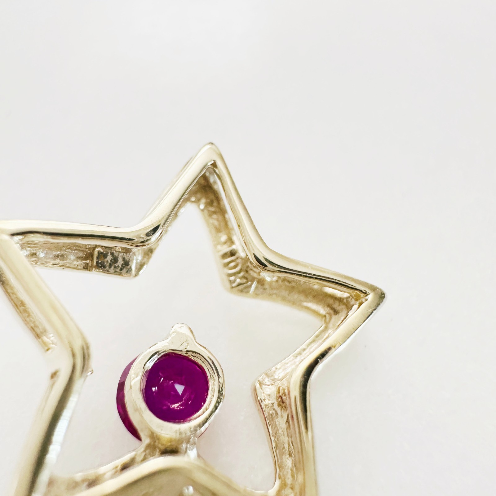 Solid 10K Yellow Gold .25ct Ruby & 7 Diamond Open Star Pendant 16mm, 1.2g