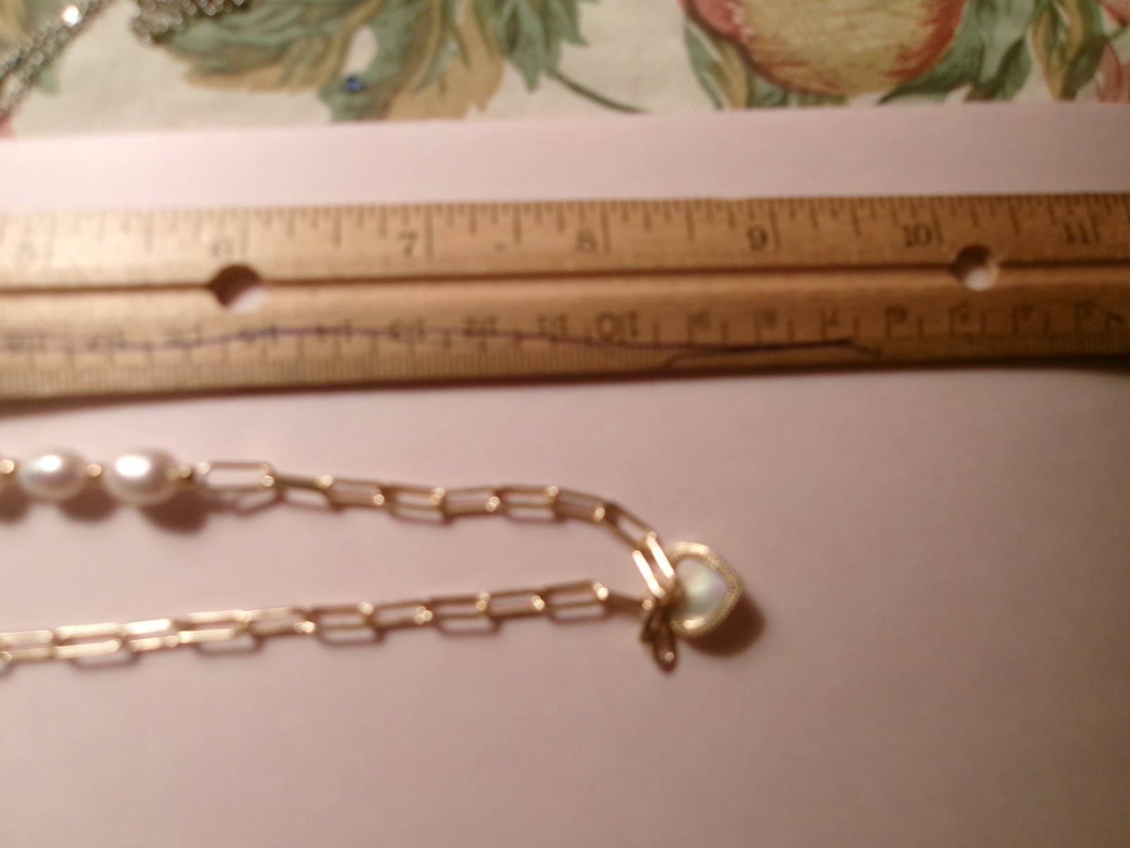 PEARL NICE SIZE REAL PEARLS…THE HEART HAS LIKE A WHITE SHELL INSIDE IT