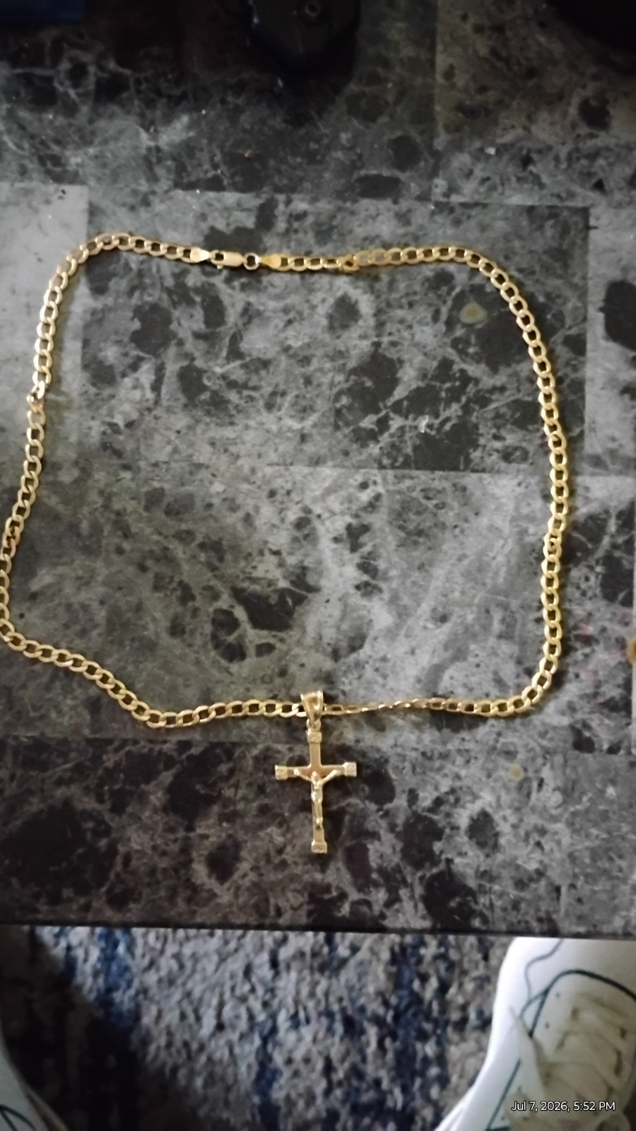 men’s or women’s 10 karat gold necklace and cross. Retail 1300.00