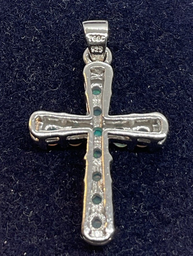 a sterling silver cross pendant With Prong Set Opals. In Excellent Condition.