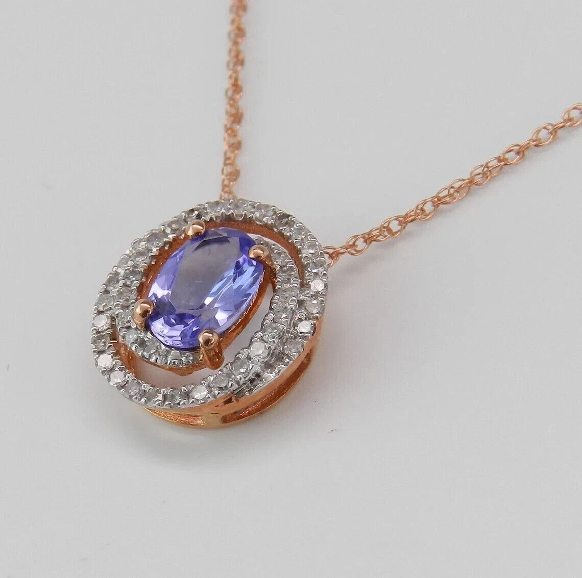 1.20Ct Oval Cut Lab-Created Blue Tanzanite Halo Pendant 14K Rose Gold Plated 18″