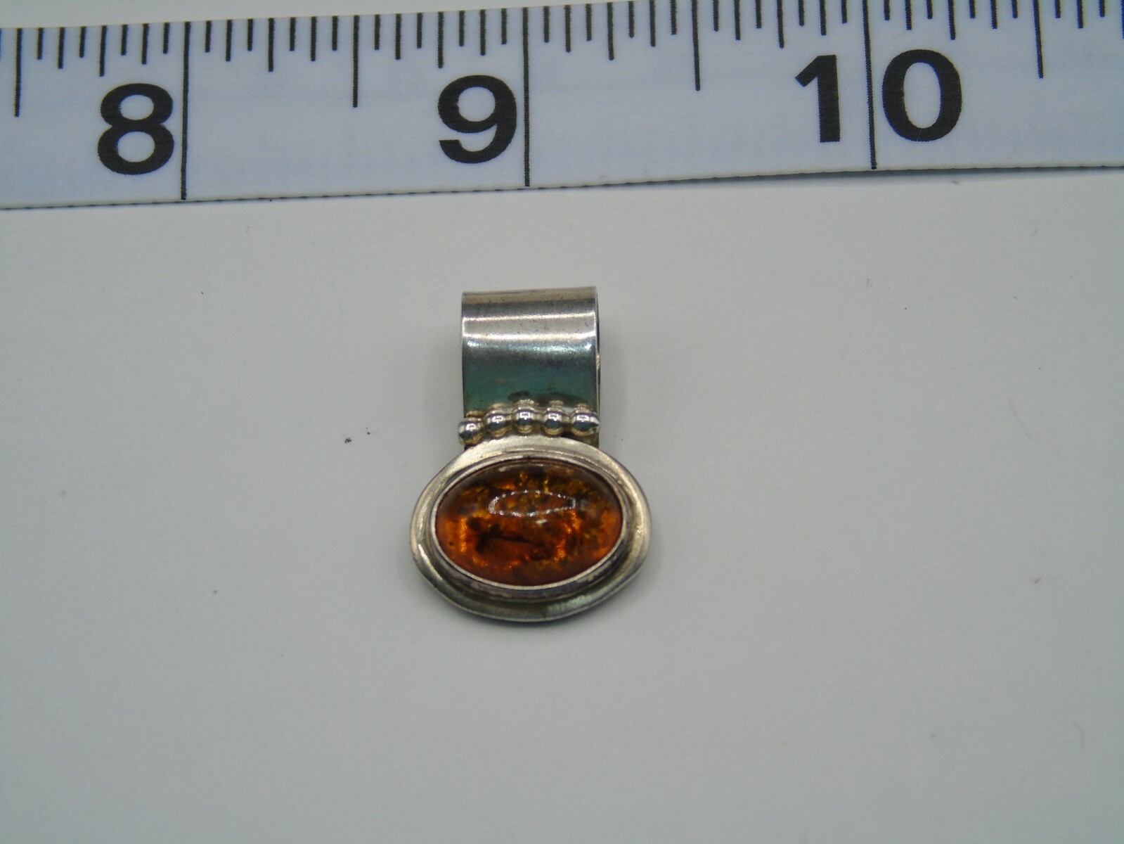 R. WILSON STERLING SILVER AND OPAL PENDANT IN PRE-OWNED VERY GOOD CONDITION
