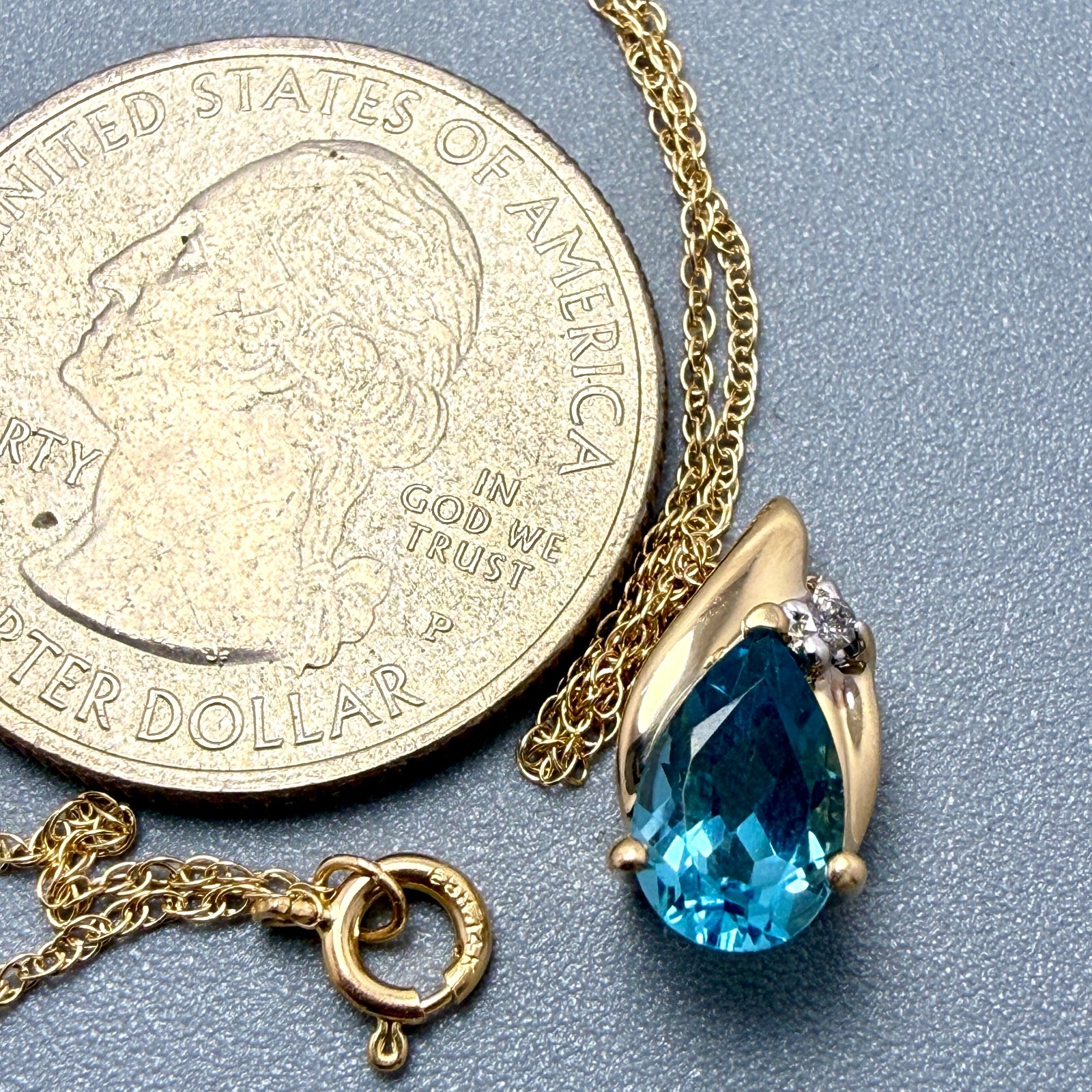 14K Yellow Gold 16″ Necklace with 8x5mm Blue Topaz & Small Diamond 2 grams