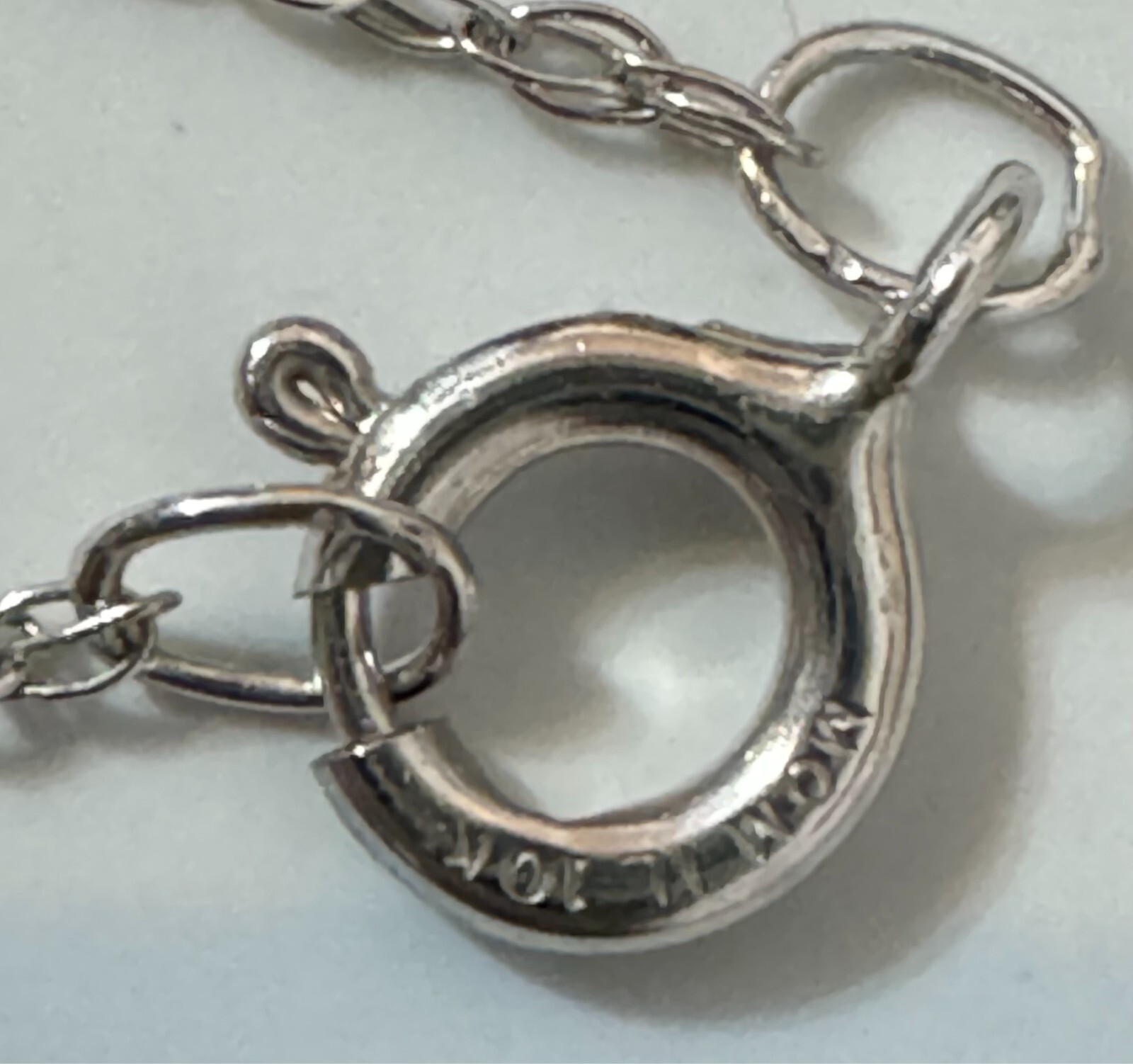 WHITE GOLD AND COLORLESS SAPPHIRE SNOWFLAKE PENDANT NECKLACE