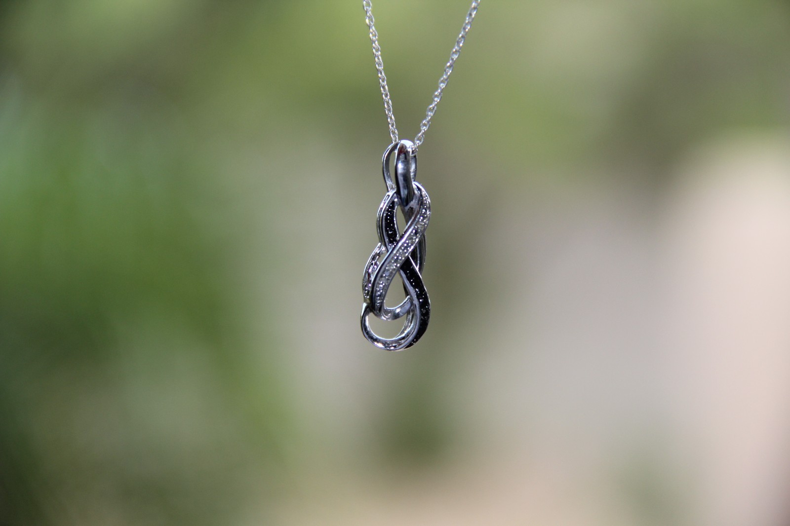 Sterling Silver Black and White Diamonds Infinity Pendant Necklace
